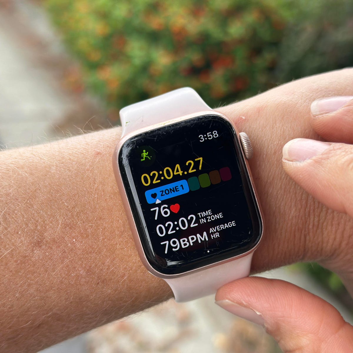 Apple Watch displaying heart rate zones on a wrist