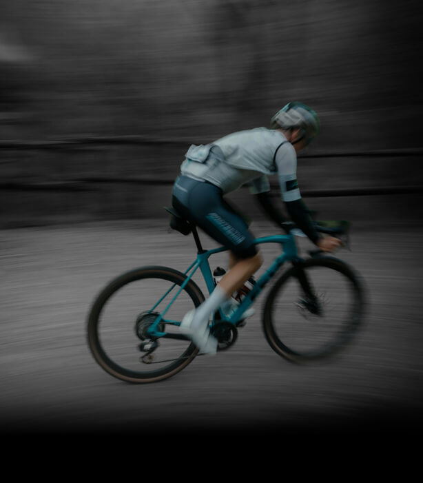 Cyclist riding hard on a road bike